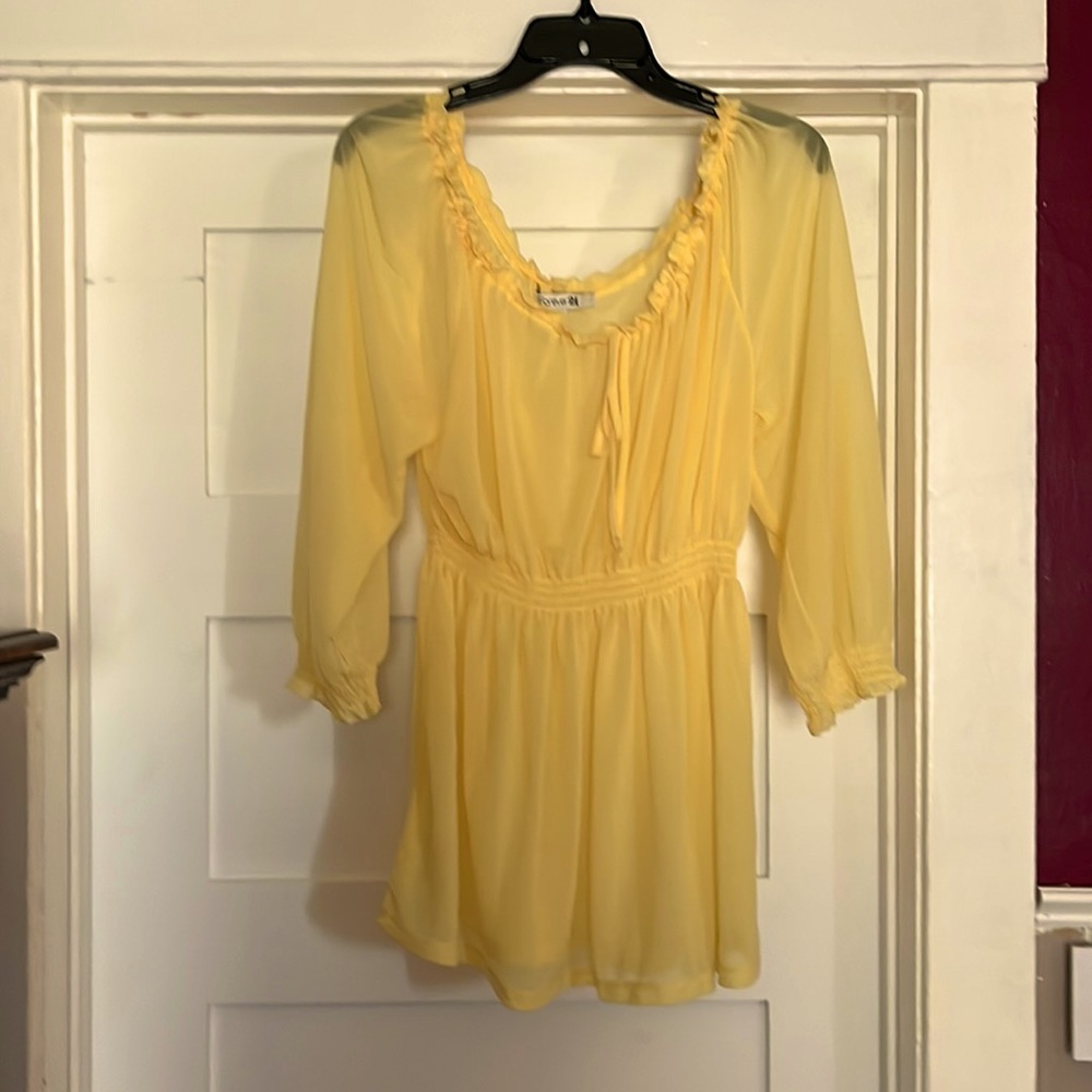 Yellow chiffon Top in mint condition size Large with elastic waist and Sleeves.